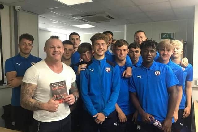 Jason Cotton, of Men-Talk, with members of the Chesterfield FC academy.