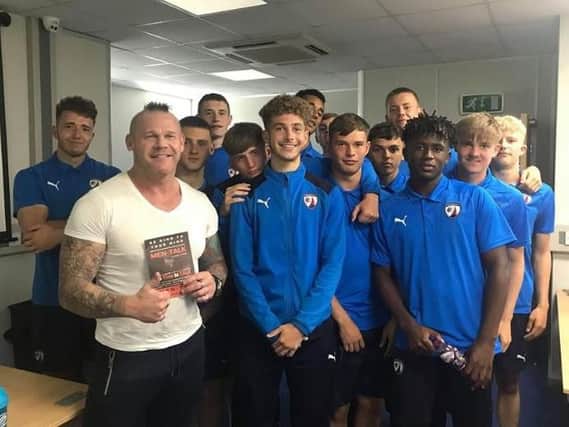 Jason Cotton, of Men-Talk, with members of the Chesterfield FC academy.