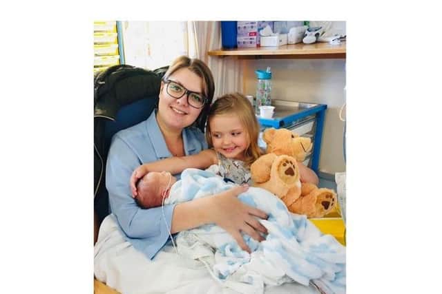 Proud mum Kirsty Johnson with Rupert and big sister Amelia, four.