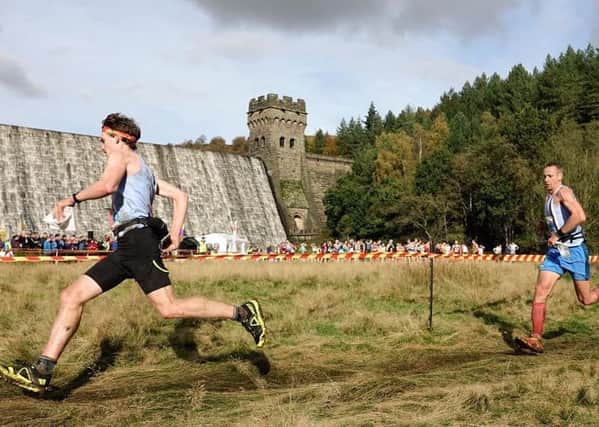 Harry Holmes leads the charge from Stuart Bond for Matlock AC at the British Fell Running Championships.