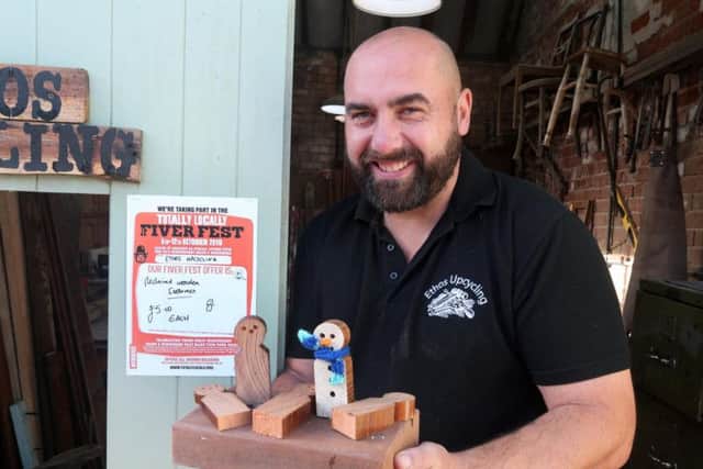 Damion Smith of Ethos Upcycling is making wooden snowmen for a fiver.