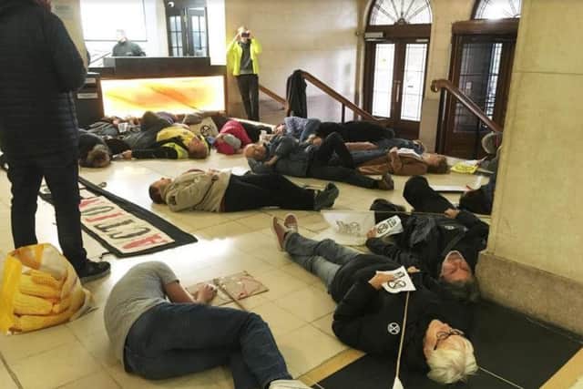 Protesters hummed and chanted while lying on the floor in the hope that councillors would hear them.