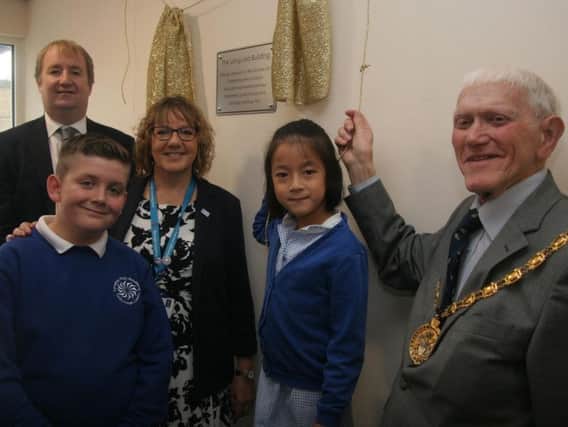 Plaque unveiling for new classrooms at Langley Mill Academy by MP Nigel Mills, Liz Anderson (CEO Djanogly learning trust) Cllr Robert Parkinson (Chair DCC) and pupils Jake Wardle and Faith Wong.