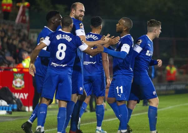 Picture Greg Dunbavand/AHPIX LTD, Football, National League, Wrexham v Chesterfield, Racecourse Ground, Wrexham, UK, 15/10/19, K.O 7.45pm

Chesterfield players celebrate a Wrexham own goal giving their side the lead.

Howard Roe>07973739229