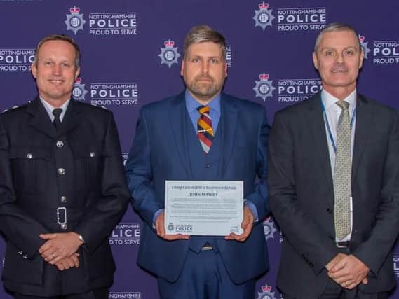 Former Bolsover resident John Mawby, centre, was presented with a commendation by senior officers from Nottinghamshire Police.