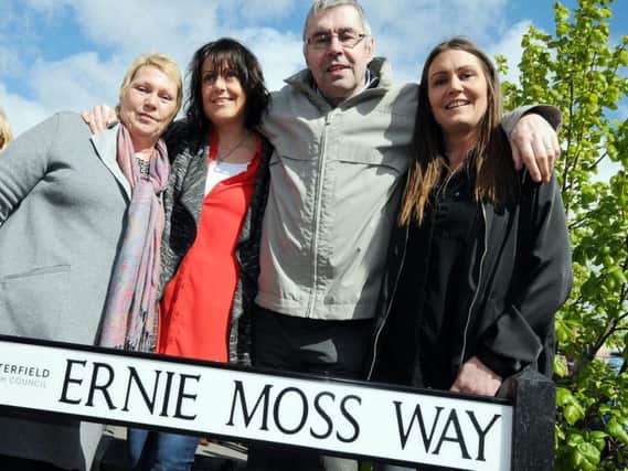 The Moss family has always believed Ernie's dementia was a result of him heading old heavy leather footballs during his career. Ernie is pictured with his wife Jenny and daughters Nikki and Sarah at the unveiling of Ernie Moss Way in 2017.