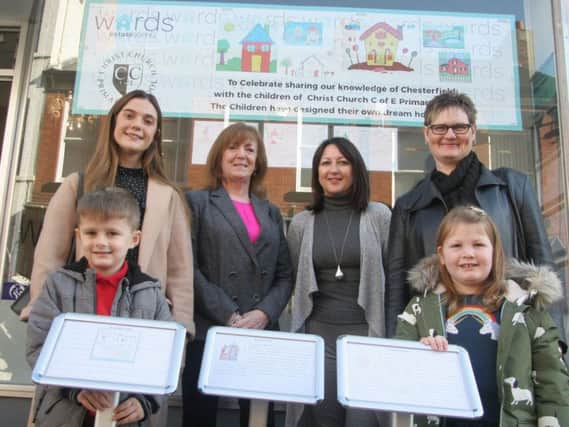 Christ Church Primary School pupils Ashton Orton and Robyn White with their dream home designs alongside year one teacher Ella Street, Wards Estate Agents director Annette Ward, sales negotiator Michele Hill and year two teacher Michelle Hunt. Picture by Rebecca Havercroft.