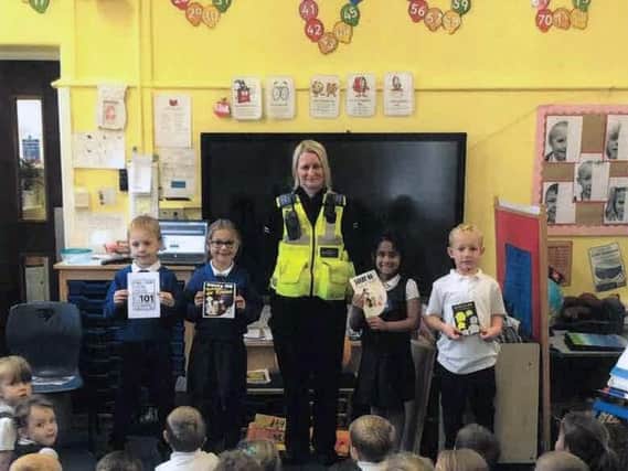 PCSO Janis Naylor with youngsters at Brimington Manor Infant and Nursery School