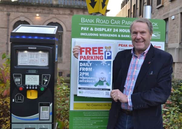 Council leader, Coun Garry Purdy, promoting the Christmas free parking initiative.