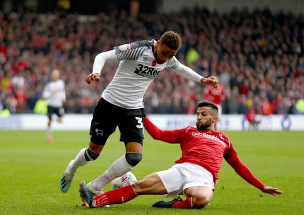 NOTTINGHAM, ENGLAND - NOVEMBER 09: Jayden Bogle of Derby County and Tiago Silva of Nottingham Forest compete for the ball during the Sky Bet Championship match between Nottingham Forest and Derby County at City Ground on November 09, 2019 in Nottingham, England. (Photo by Getty Images/Getty Images)