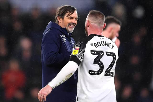 Phillip Cocu, manager of Derby County, celebrates victory with Wayne Rooney. Photo by Laurence Griffiths/Getty Images.