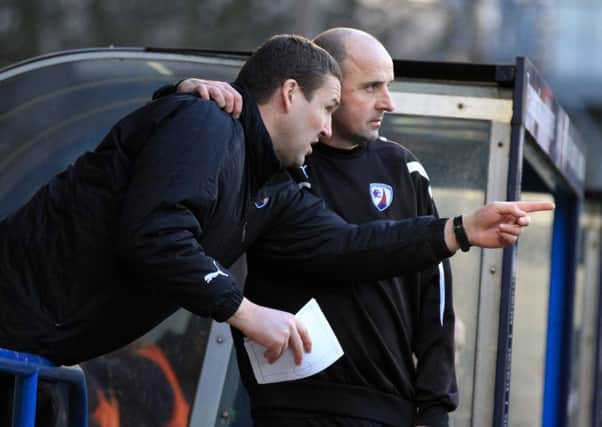Manager Paul Cook gets some match insight from coach Mark Crossley by Tina Jenner Rochdale v Chesterfield
