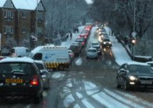 Pictured is grid-locked traffic during recent rush-hour snow hazards.