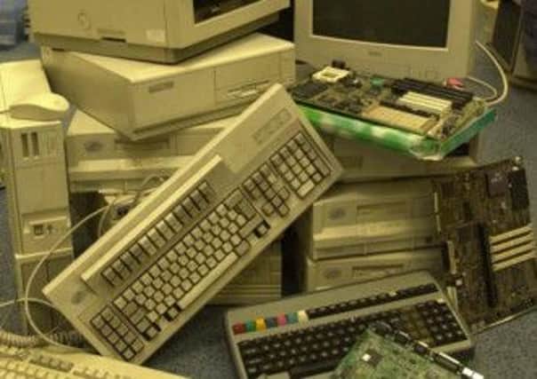 James Wallbank . with some of the computer equipment that  is recycled by Access Space/Redundant Technology ,Sidney Street. 26 January 2001
