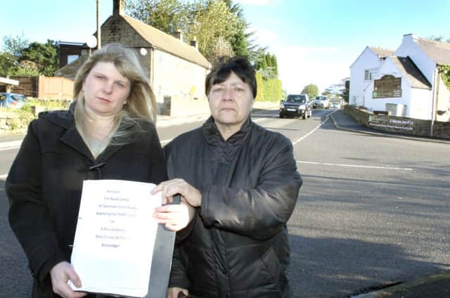 NDET 03-10-12 MC 1
Becky Carline and Margaret Renshaw with their petition about reducing the speed limits on the A632 and adding traffic lights to the Spancarr junction to reduce accidents.