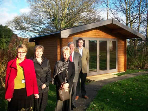 Pictured outside the lodge are Hugh, Bev and Nick Grayson from Pinelog with Kathy Hollyer and Jane Bridge from the hospice.