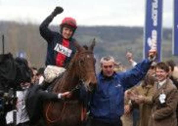 GOLD CUP HEROES -- Bobs Worth returns to the winner's enclosure with jubilant jockey Barry Geraghty (PHOTO BY: David Davies/PA Wire).