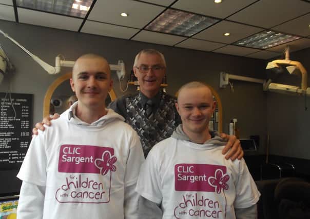 Will and Chris Goodwin after their head shave at Ian's Hairdresser's.