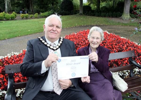 Flower Power: Matlock In Bloom committee members Cllr Barry Hopkinson and Tottie Holden with their East Midlands in Bloom Silver award for Hall Leys Park.