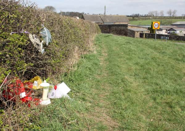 Tributes layed on Calow Lane following death