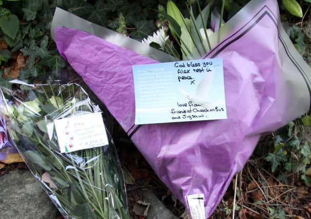Matlock Murder: More floral tributes are laid at the scene where the body of Alexander Blick was discovered in the grounds of Matlock library last Sunday.