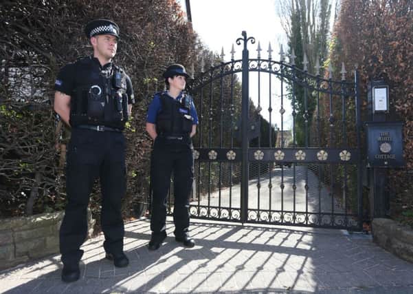 Police officers outside the gates leading onto the driveway of the home of Coronation Street actor Bill Roache in Cheshire after it was announced that he has been arrested on suspicion of an historic allegation of a sexual assault. PRESS ASSOCIATION Photo. Picture date: Wednesday May 1, 2013. See PA story POLICE Roache. Photo credit should read: Dave Thompson/PA Wire