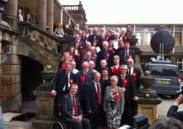 Derbyshire County Council Labour Party members celebrate regaining control of the local authority from the Conservatives after a landslide victory at the 2013 local elections.
