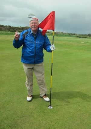 Alan Harker is pictured after his hole-in-one in Northumberland.