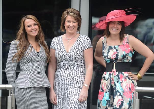 Modelling clothes donated to Helen's Trust, Sophie Gill in an Autograph dress and Whiteley hat, Karen Goddard in a Phase Eight dress and Jordan Sutherland in an Elegance suit