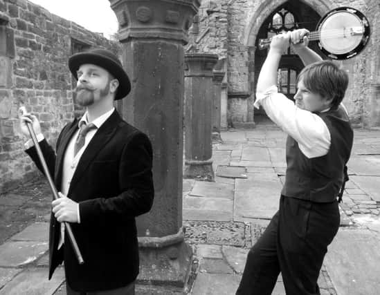 The Wells Brothers present a wry revue of Vaudevillian music and magic in Messrs. Wells.