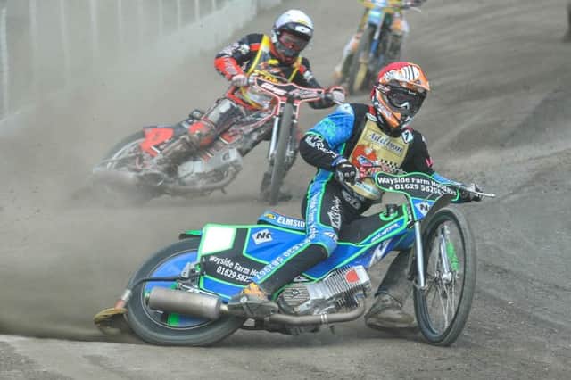 Buxton's Charles Wright leads Coventry's James Sarjeant. Photo: Ian Charles.