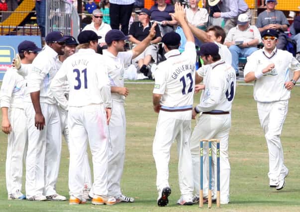 Derbyshire Cricket Club play in Queen's Park against Northamptonshire. Celebrations after AJ Hall from Northants was caught out by Chesney Hughes.