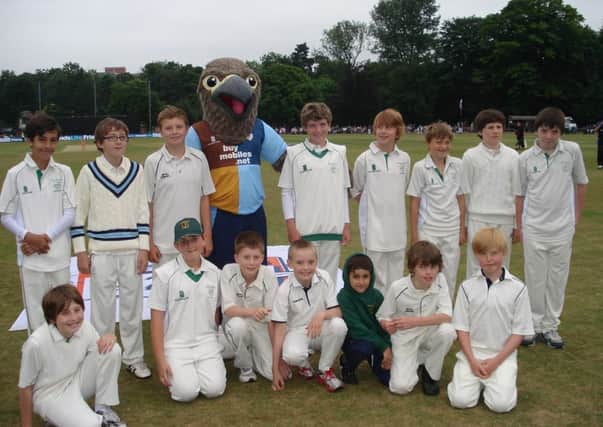 Buxton CC juniors with Derbyshire mascot Freddie the Falcon