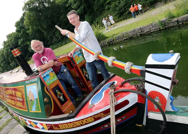 At the tiller...Councillor Andy Botham, right, and Friends of Cromford Canal's Mike Kelley aboard 'Birdswood'