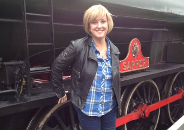 Sharon Holland Taylor with the steam train at Peak Rail