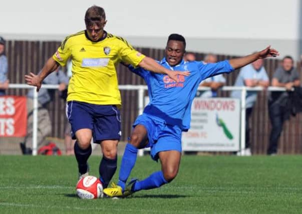 Worksop Town v Matlock Town, pictured is Jack Muldoon being challenged by Lavell White (right) (w130827-5b)