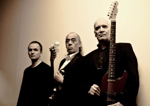 Wilko Johnson, far right, and his band.
