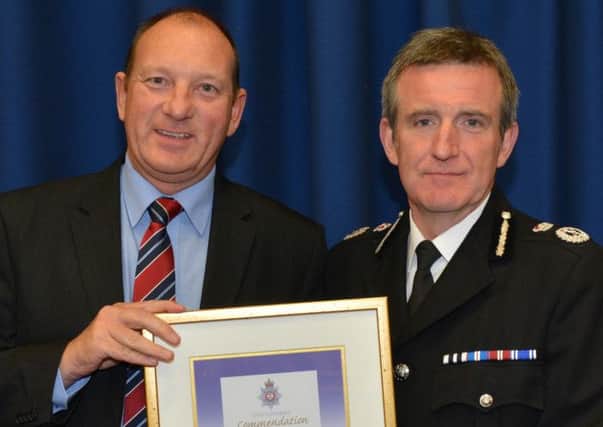 Buxton Detective Constable Gary Hobson with Chief Constable Mick Creedon.
