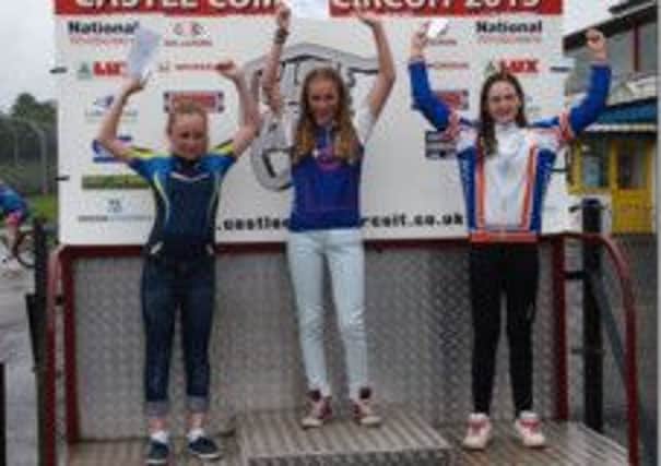 Ellie Smith (centre) is pictured on the podium.