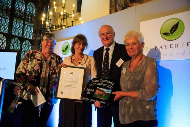 Elspeth (right) with her award. She is pictured category judge Liz Evans (left), from the Health & Safety Executive, FACE President, Lord Henry Plumb (second right) an her colleague Liz Burrow (second left).who was the category judge.