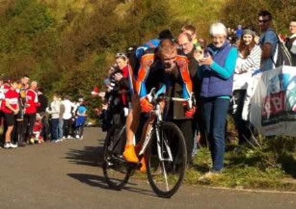 Pictured is a rider battling it out at the top of the 2012 Monsal Hill Climb.