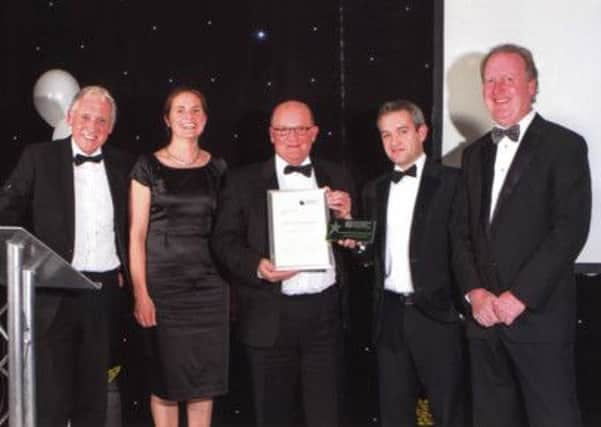 Henry Boot Construction award winners Andy Atkinson, Richard Grafton and Dave Woodhouse, Claire Bowles (Centre for Knowledge Exchange) and, far left, TV's  Harry Gration.