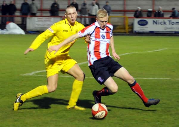 Oscar Radford (left) is pictured in action at Witton Albion on Saturday in a game his side dominated but lost by a single goal. Photo by Matt Sayle.