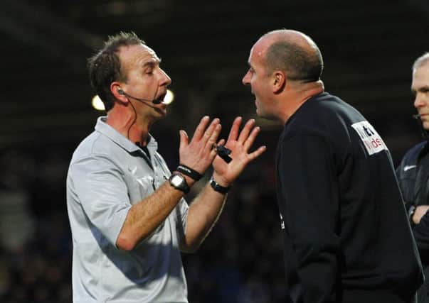 Referee  Mike Russell gives Spireites Manager Paul Cook a talking to during the FA Cup clash with Southend by Tina Jenner Chesterfield v Southend