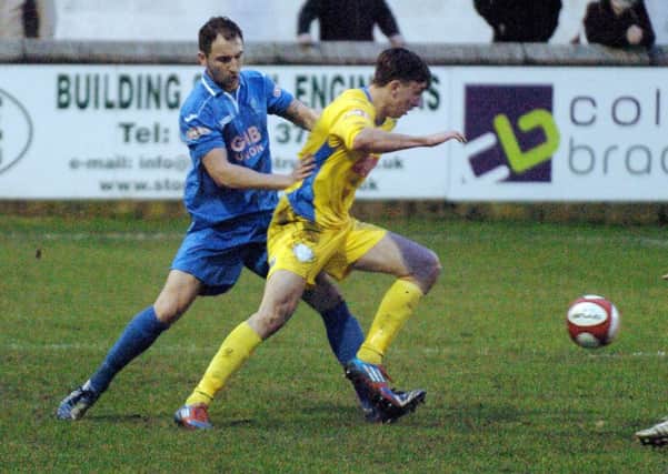 Matlock defender David Haggerty (left) gets involved against the Linnets on Saturday.