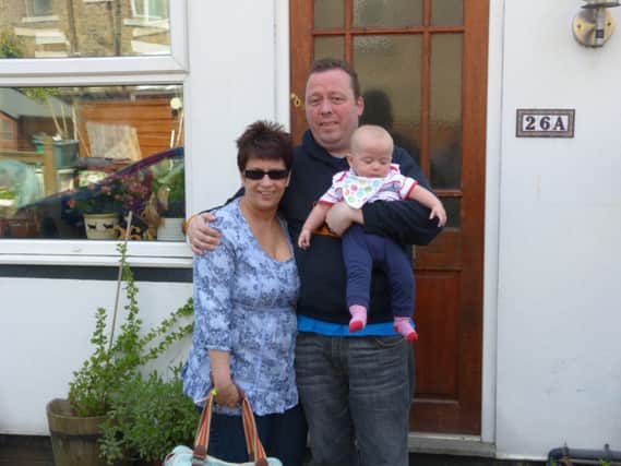 MS sufferer Tim Barnett, of Glossop, with his wife Emma and one-year-old son Ralph. Photo contributed.