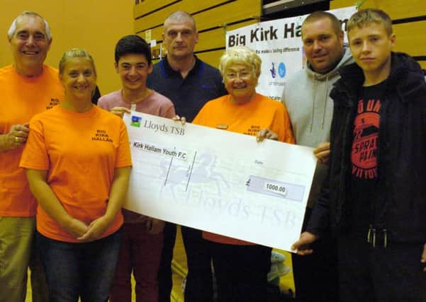 The big Kirk Hallam present a cheque to Kirk Hallam youth FC for £1000