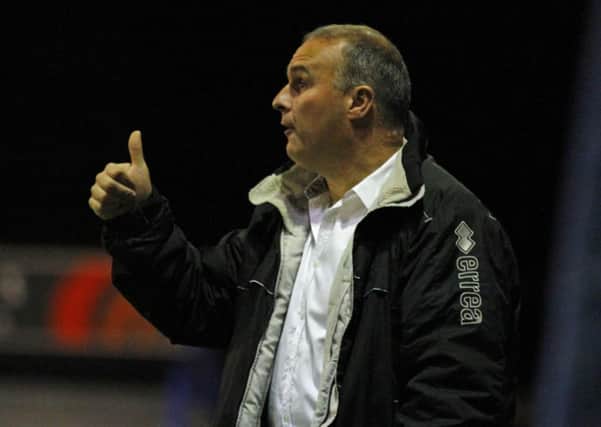 Matlock Manager Mark Atkins gives the thumbs up during his sides home fixture against Chorley by Tina Jenner