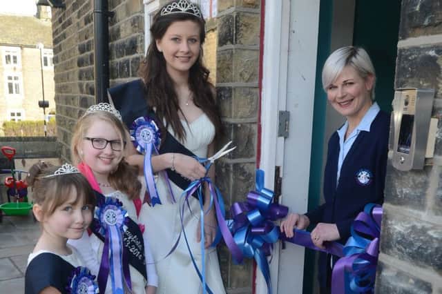 Hayfield May Queen royalty, Sheridan, Poppy and Amber help owner Kimberly Munro open the new Blue Grass Purple Cow Nursery in Hayfield