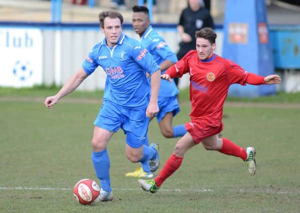 Danny Holland (left) gets forward against Skelmersdale United on Saturday. Holland scored an impressive late winner and then scored two more in the 4-1 win over Grantham on Tuesday
